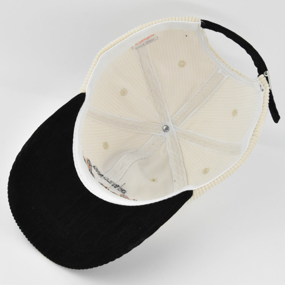 Black/White corduroy dome baseball cap with adjustable size and embroidered design for casual wear.
