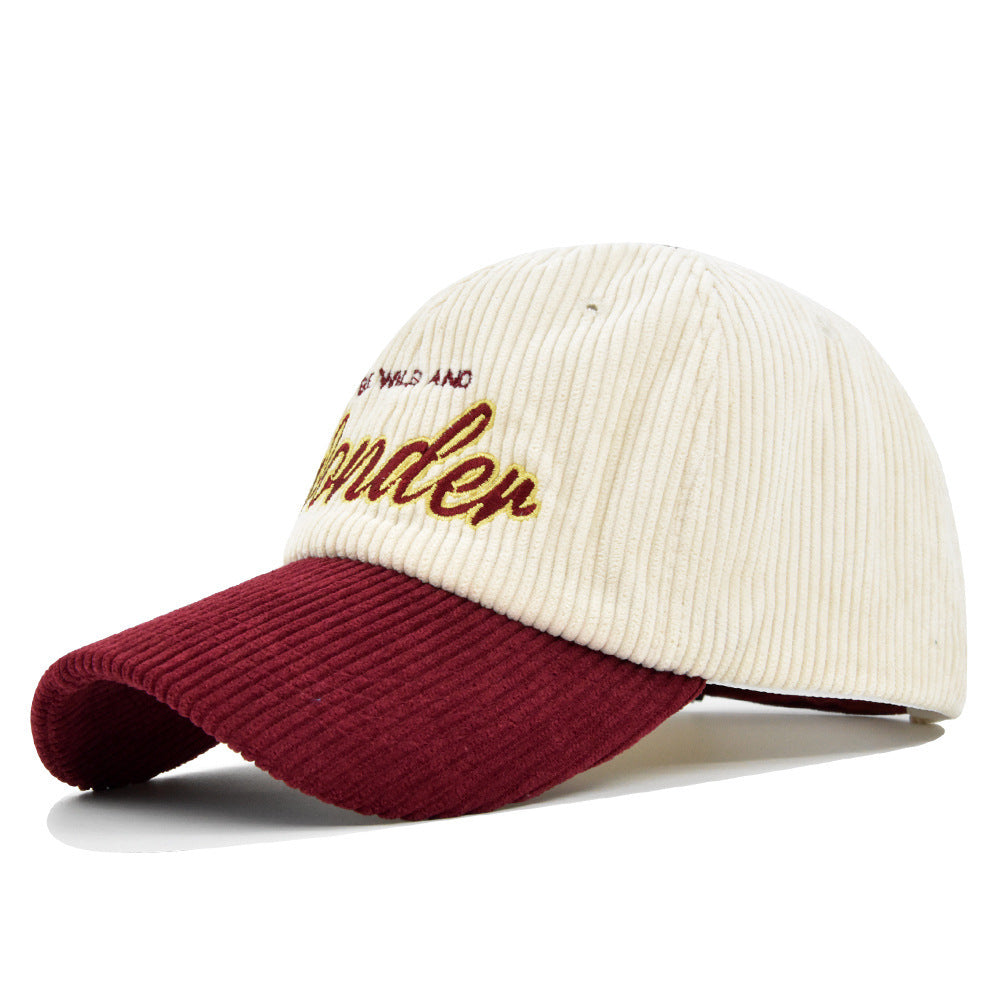 Wine/White corduroy dome baseball cap with adjustable size and embroidered design for casual wear.
